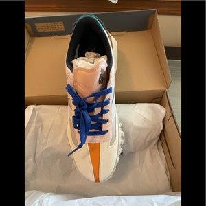 Men’s size 9 New Balance Running/Athletic shoes. Color: Beige/multi